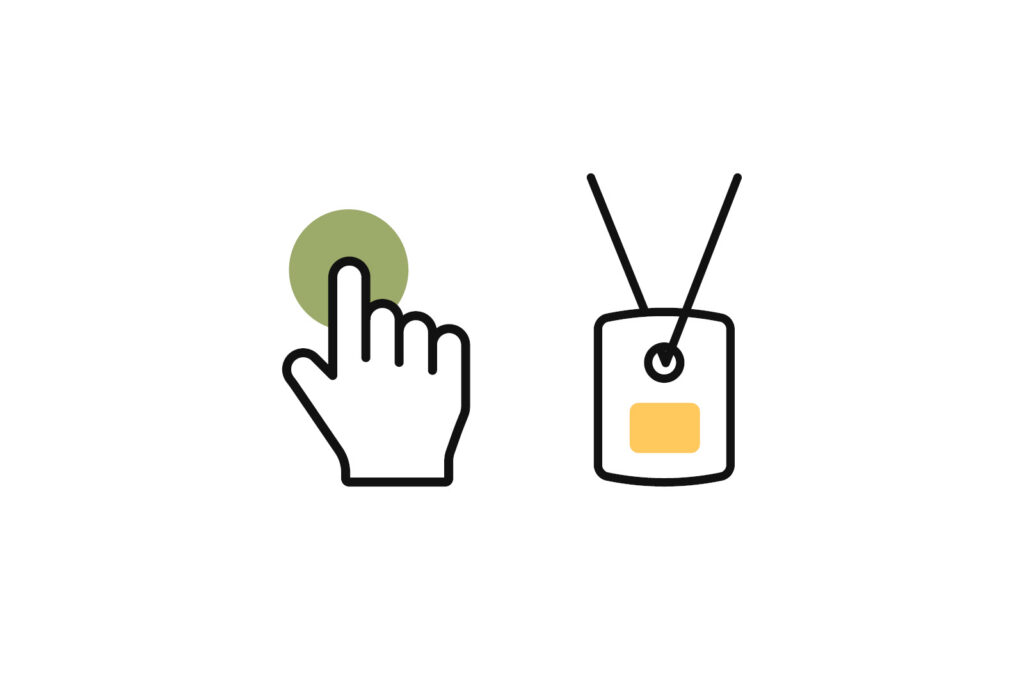 Hand pressing a button next to a wearable alarm pendant, illustrating indoor personal alarm activation.