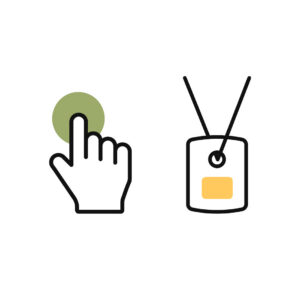 Hand pressing a button next to a wearable alarm pendant, illustrating indoor personal alarm activation.